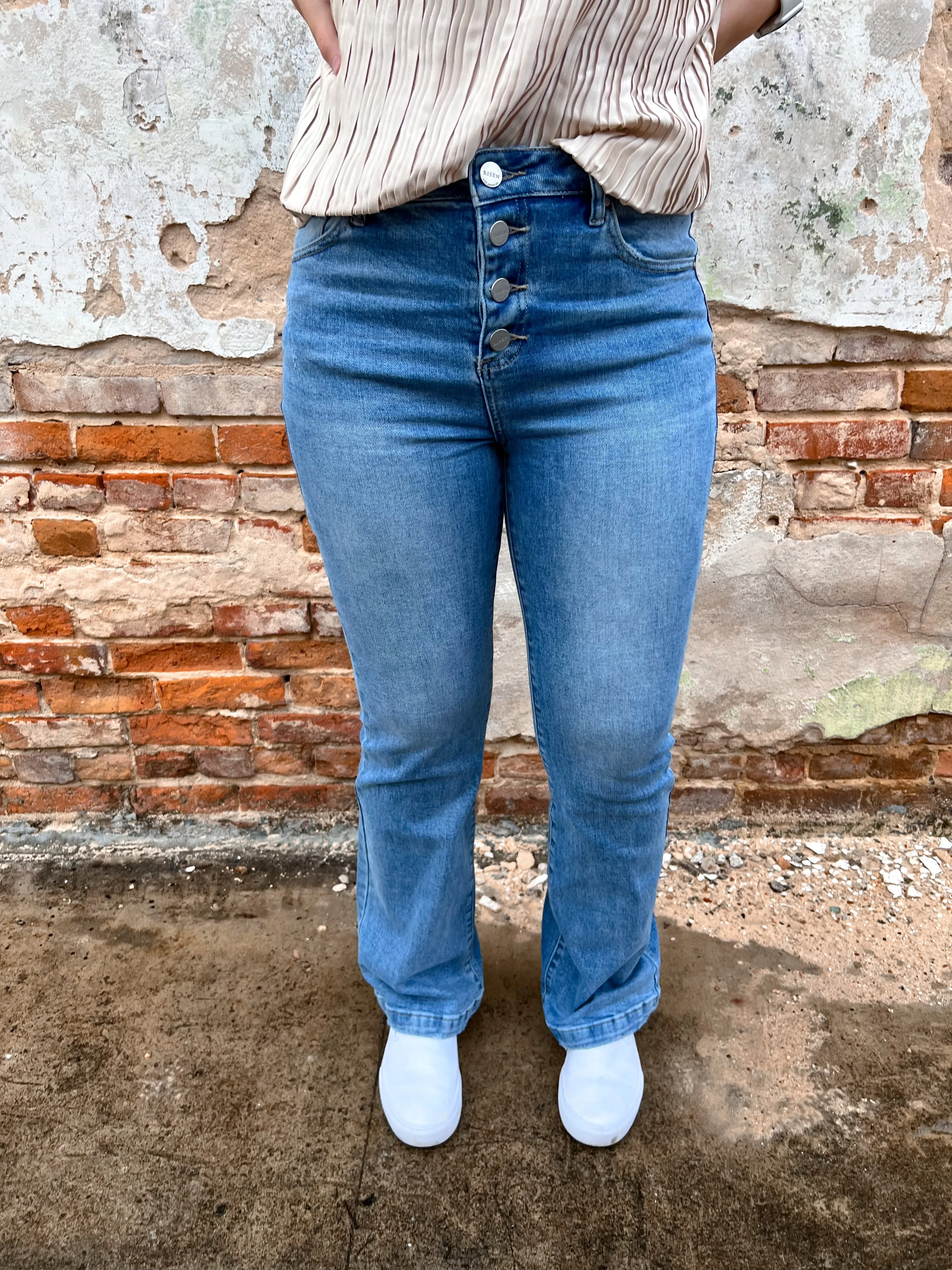 Alaia High Rise Button Down Boot Cut Jeans